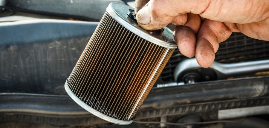 showing fuel filter infront of a car